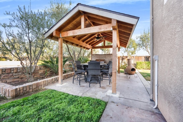 view of patio featuring ceiling fan and a gazebo