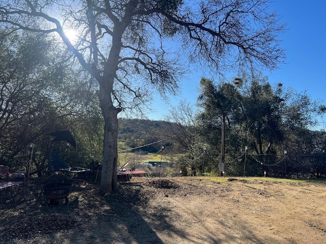 view of yard with an outdoor fire pit