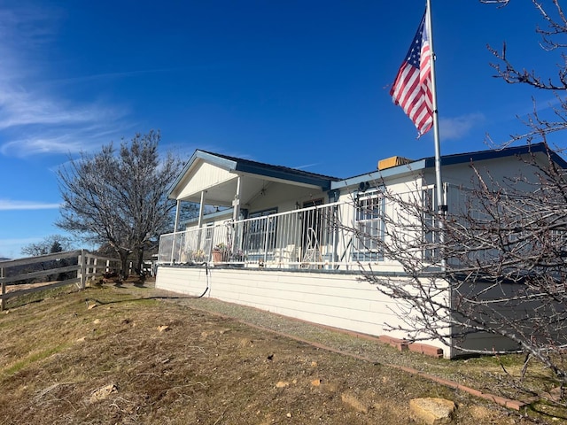 view of home's exterior featuring fence