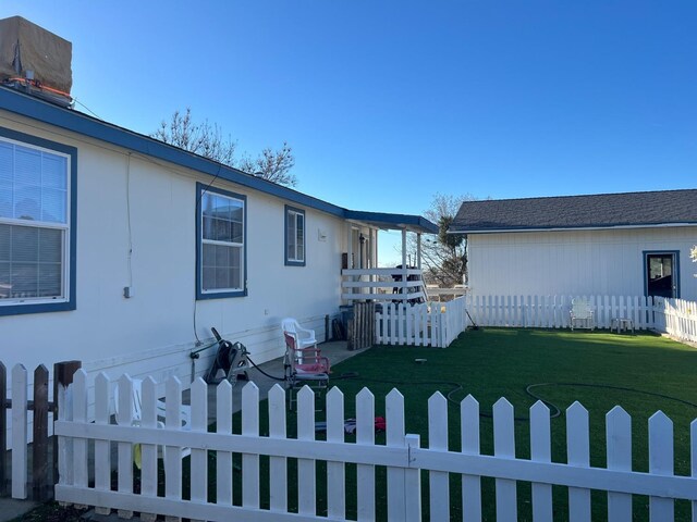 view of property exterior featuring a lawn