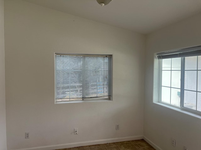 empty room with baseboards