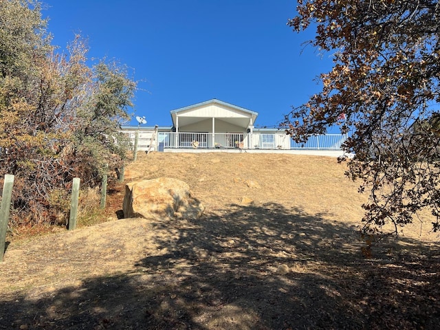 rear view of house with fence