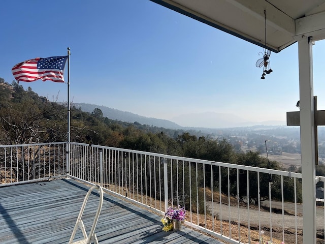 wooden deck with a mountain view