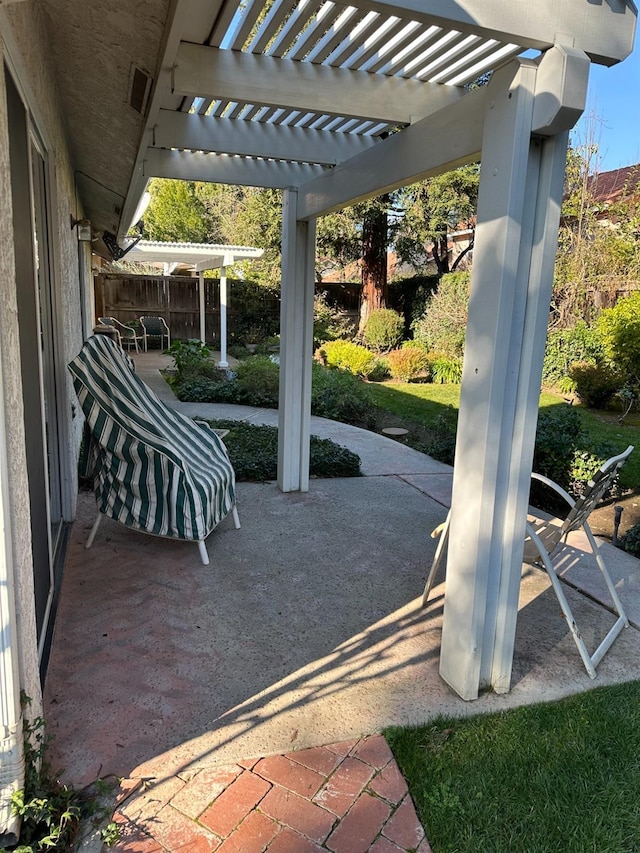 view of patio featuring a pergola