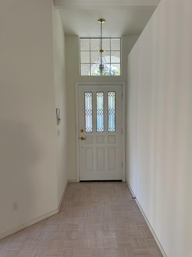 entryway featuring a high ceiling