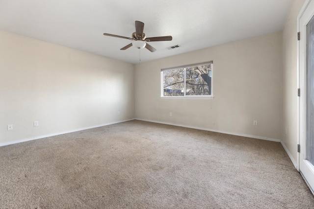 spare room with ceiling fan and carpet flooring