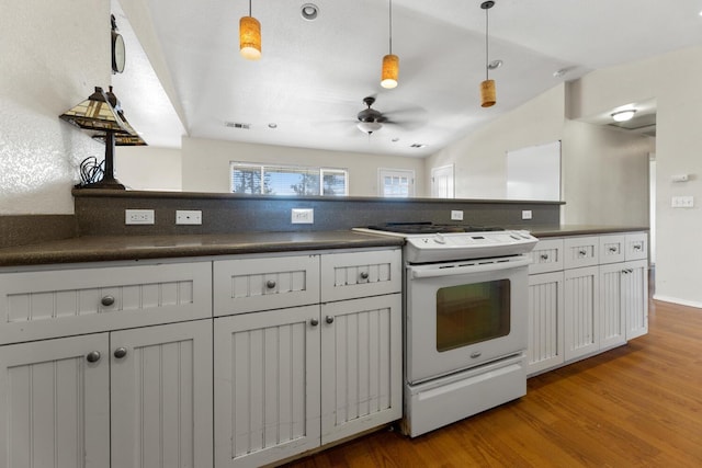 kitchen with ceiling fan, vaulted ceiling, light hardwood / wood-style flooring, hanging light fixtures, and white range