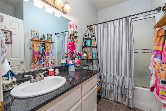 bathroom with tile patterned floors, vanity, and shower / tub combo with curtain