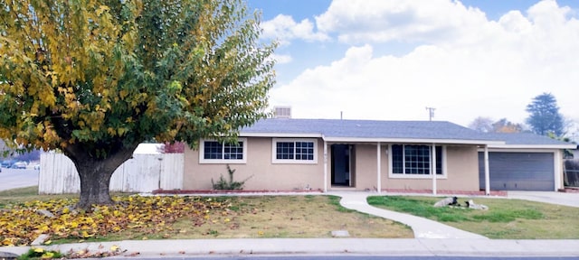 ranch-style house featuring a garage