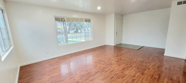 empty room featuring hardwood / wood-style floors