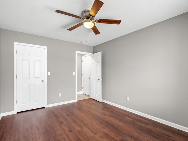 unfurnished bedroom with dark wood-type flooring and ceiling fan