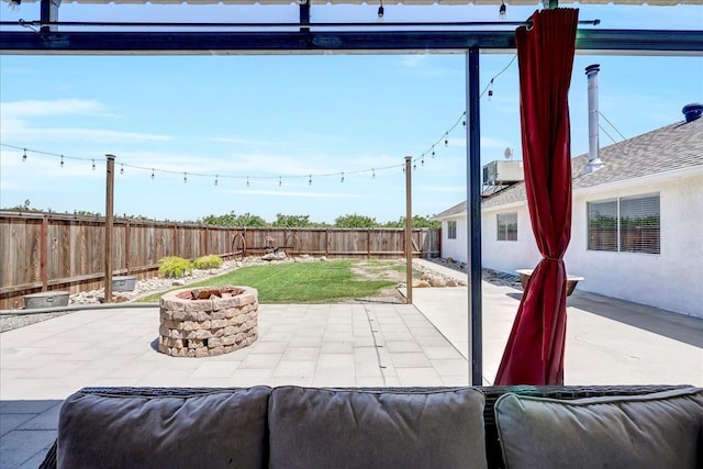 view of patio featuring a fire pit