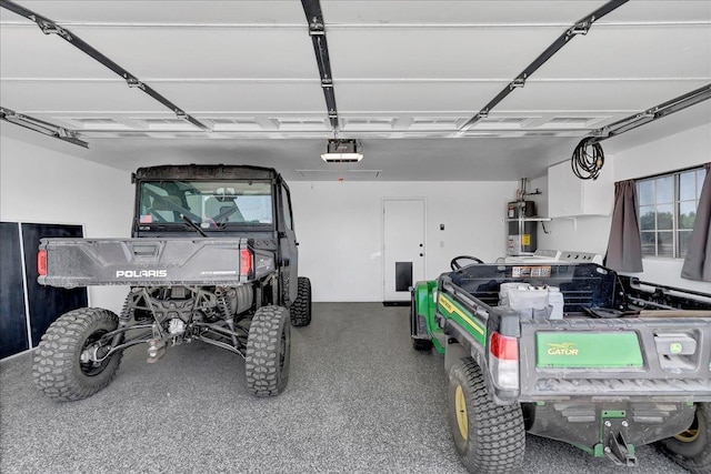 garage featuring water heater and a garage door opener