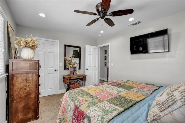 bedroom featuring light carpet and ceiling fan