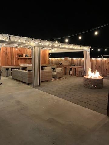 view of patio with a fire pit