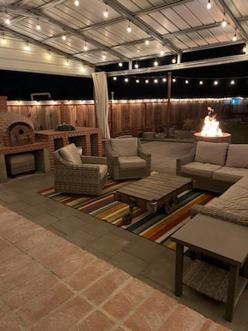 view of patio / terrace featuring an outdoor fire pit