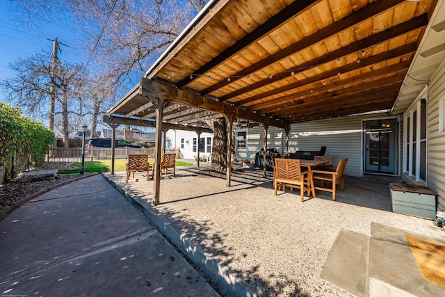 view of patio / terrace featuring outdoor dining space and fence