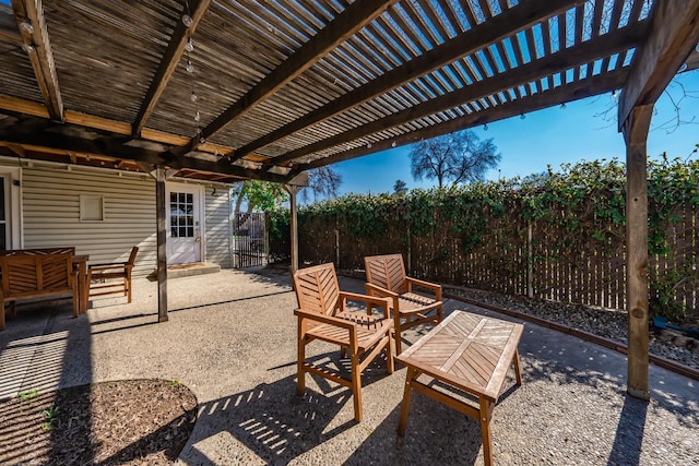 view of patio / terrace featuring fence and a pergola