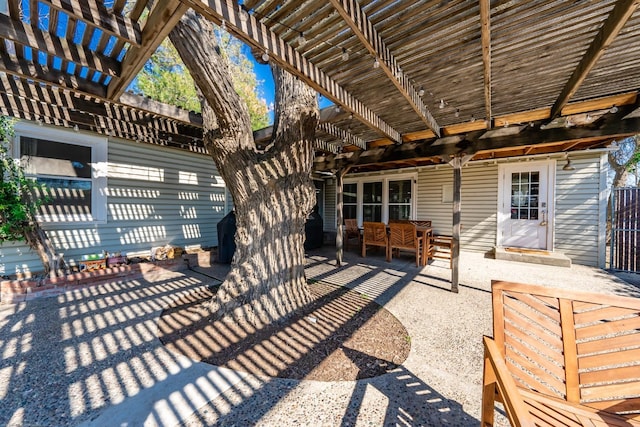 view of patio with outdoor dining space and a pergola