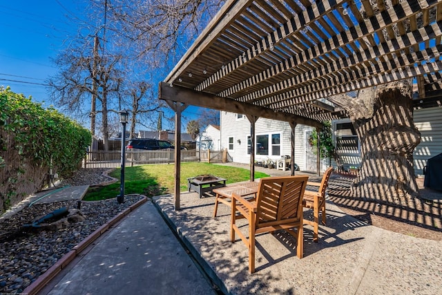 view of patio with an outdoor fire pit, a fenced backyard, and a pergola