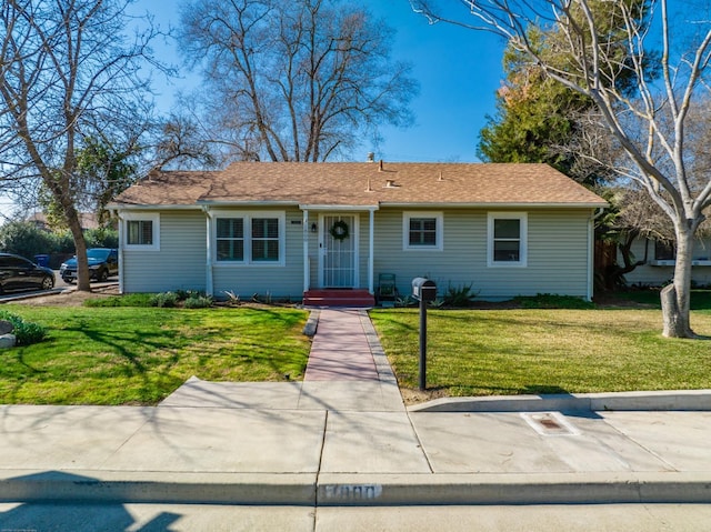 ranch-style house with a front yard