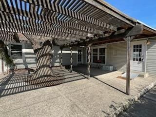 back of house with a patio and a pergola