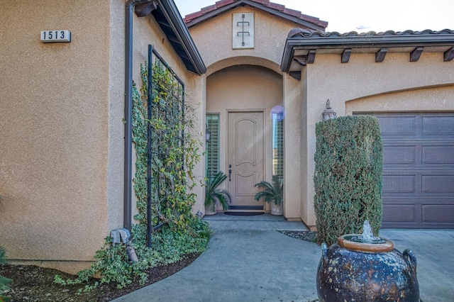 entrance to property featuring a garage