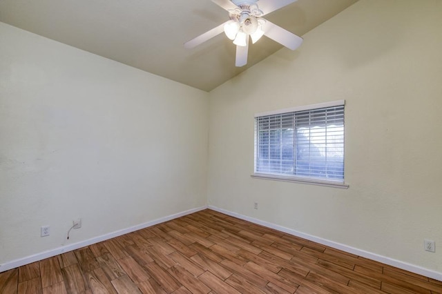 empty room featuring light wood-type flooring, ceiling fan, and vaulted ceiling