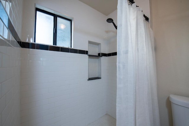 bathroom with toilet and curtained shower