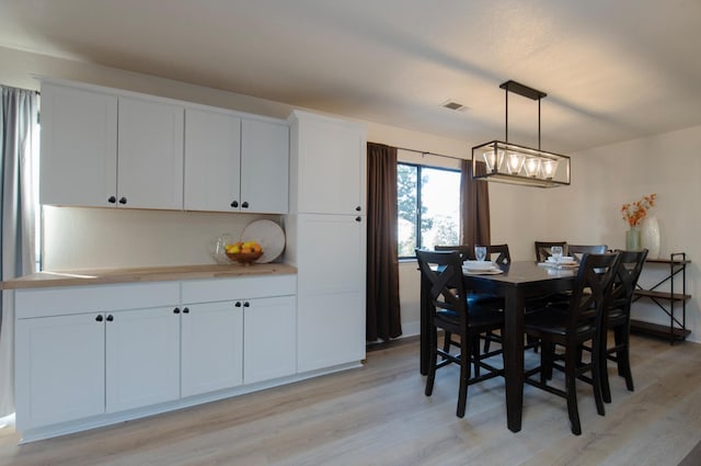 dining room featuring light hardwood / wood-style flooring