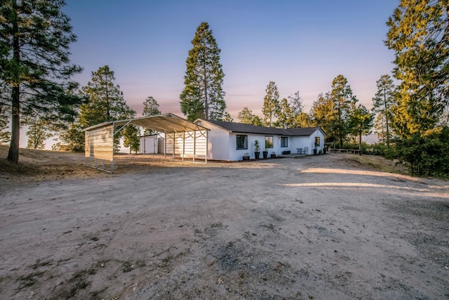 ranch-style house featuring a carport