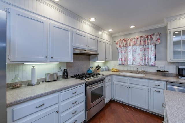 kitchen featuring white cabinets, appliances with stainless steel finishes, and sink