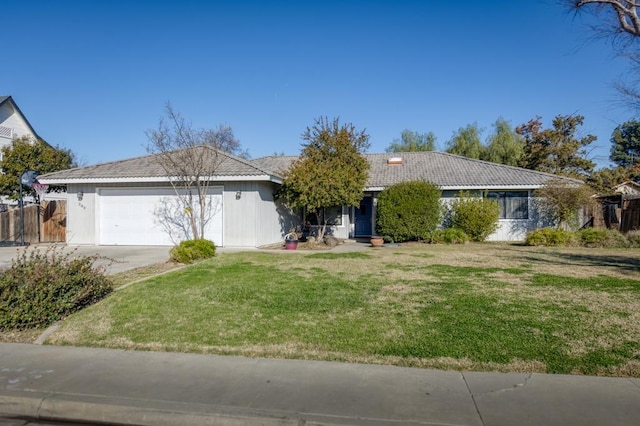 single story home with a front yard and a garage