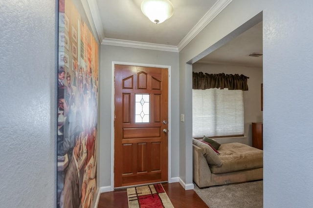 foyer with hardwood / wood-style flooring and crown molding