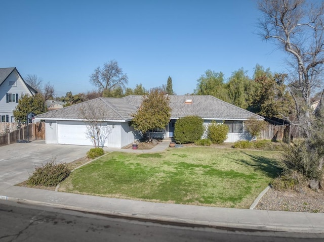 ranch-style home with a front yard and a garage