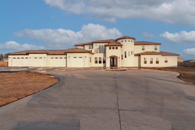 mediterranean / spanish-style home featuring a garage