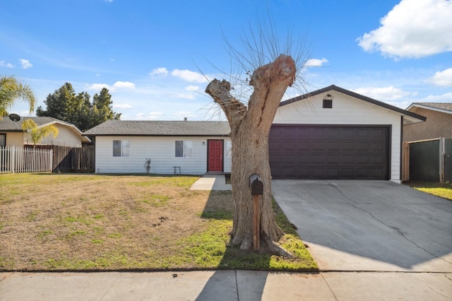 ranch-style home featuring a front lawn and a garage