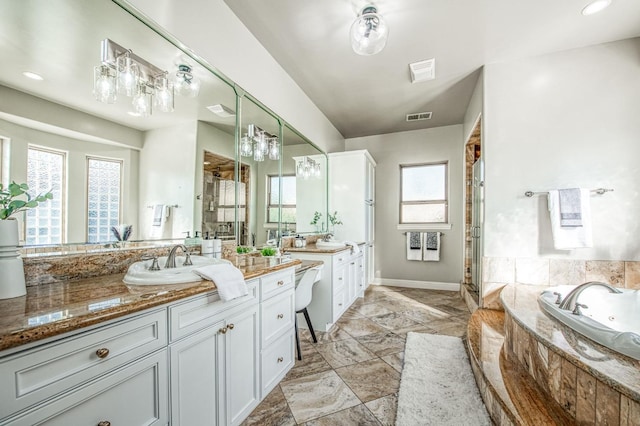 bathroom with separate shower and tub and vanity