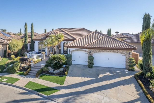 mediterranean / spanish-style house featuring a garage