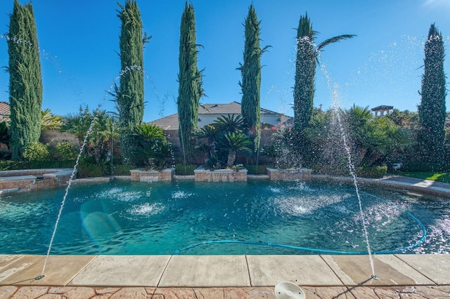 view of pool featuring pool water feature