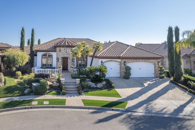 mediterranean / spanish-style home featuring a garage