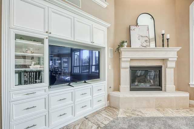 unfurnished living room featuring a fireplace