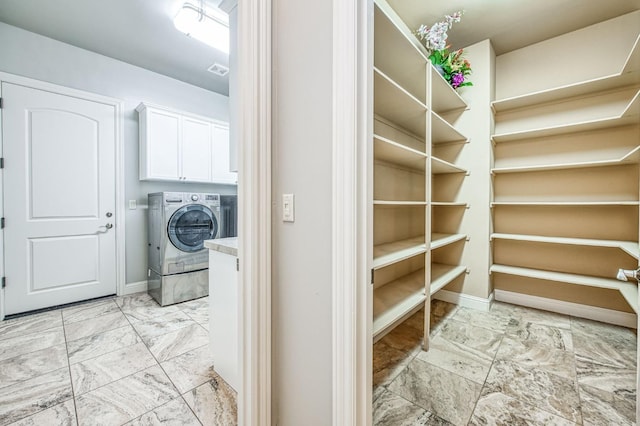 pantry featuring washer / dryer