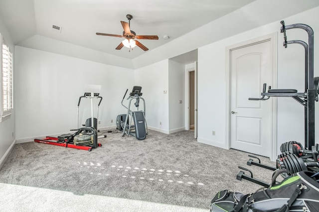 exercise area featuring lofted ceiling, ceiling fan, and carpet flooring