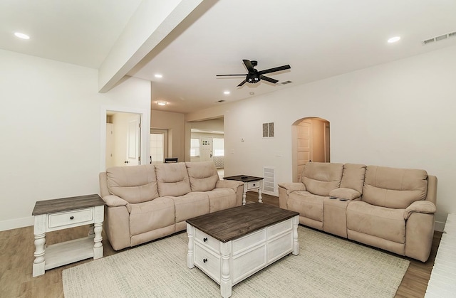 living room featuring ceiling fan and light hardwood / wood-style floors