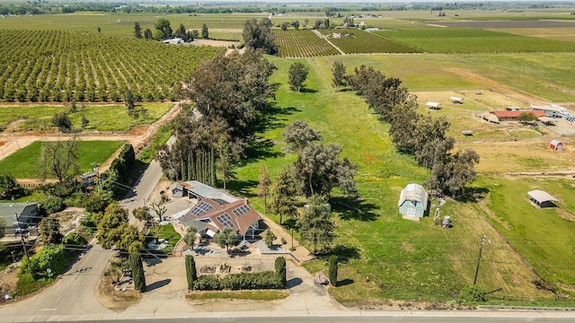 birds eye view of property with a rural view