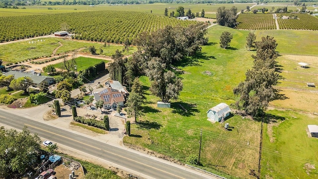 birds eye view of property with a rural view