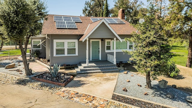 view of front of home featuring solar panels