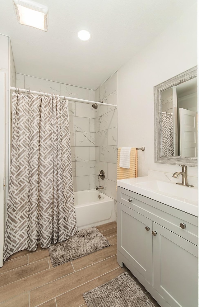 bathroom featuring vanity and shower / bath combo