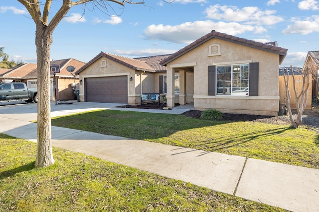 ranch-style home with a front yard and a garage